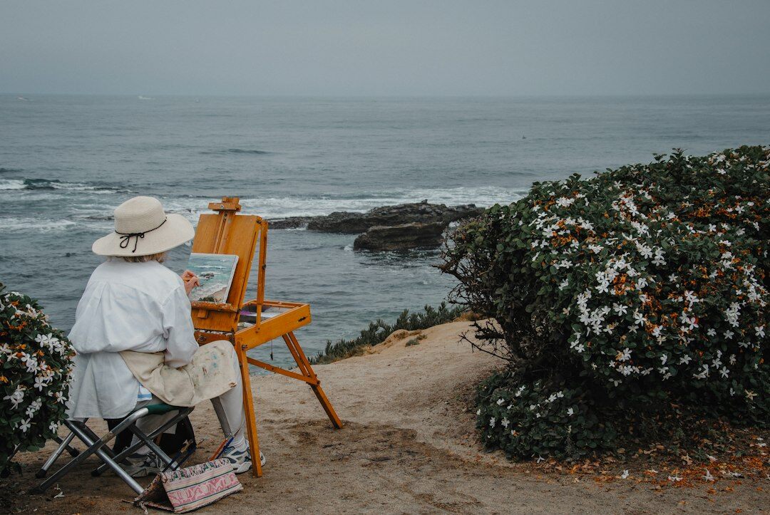 person painting canvas