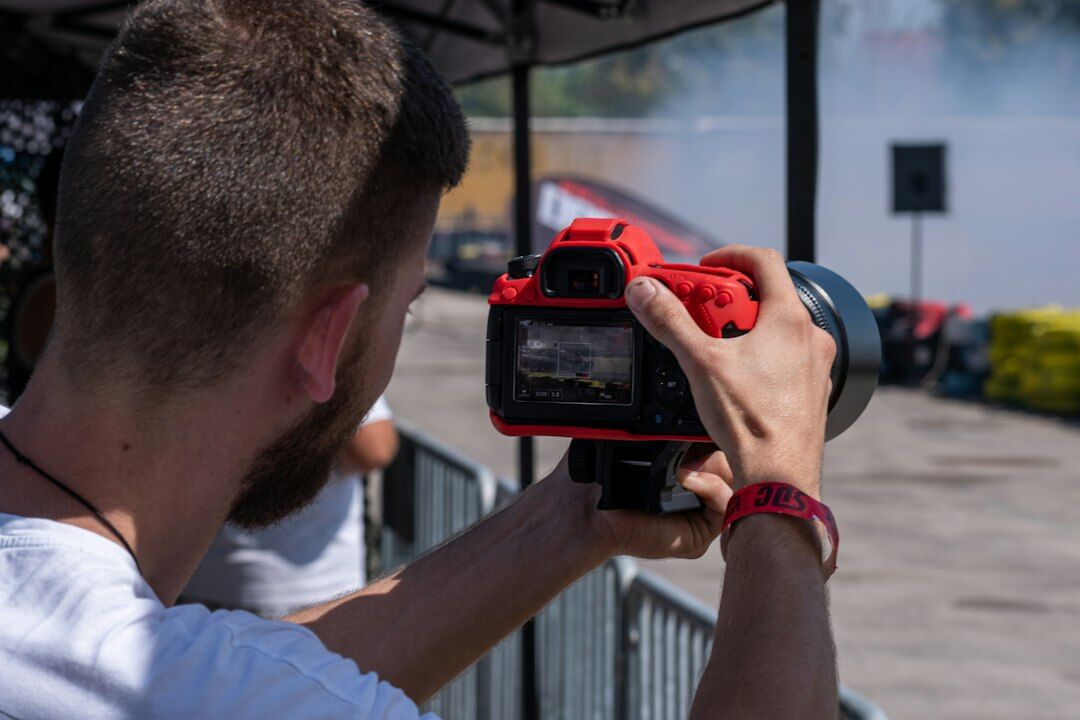 Photographer capturing a celebrity event with a professional camera